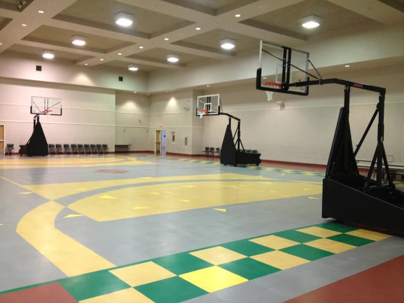 orange lowered portable basketball goal and clear acrylic backboard